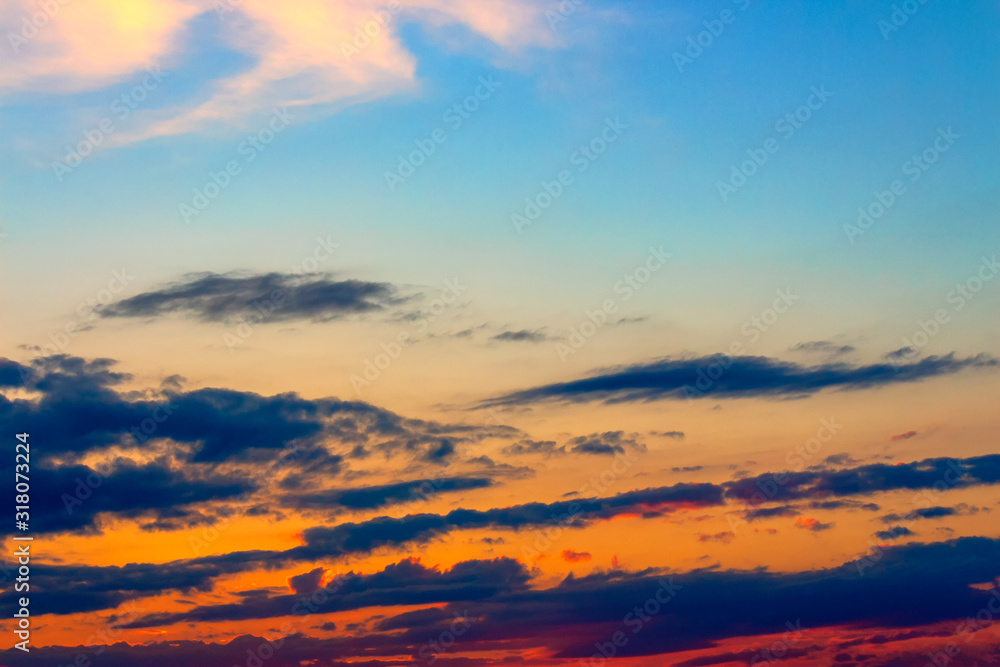 orange sunset sky with clouds. beautiful nature background