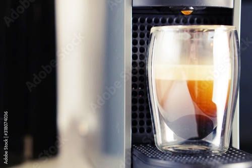 Coffee time in office. Capsule espresso in double glass cup - 100  arabica