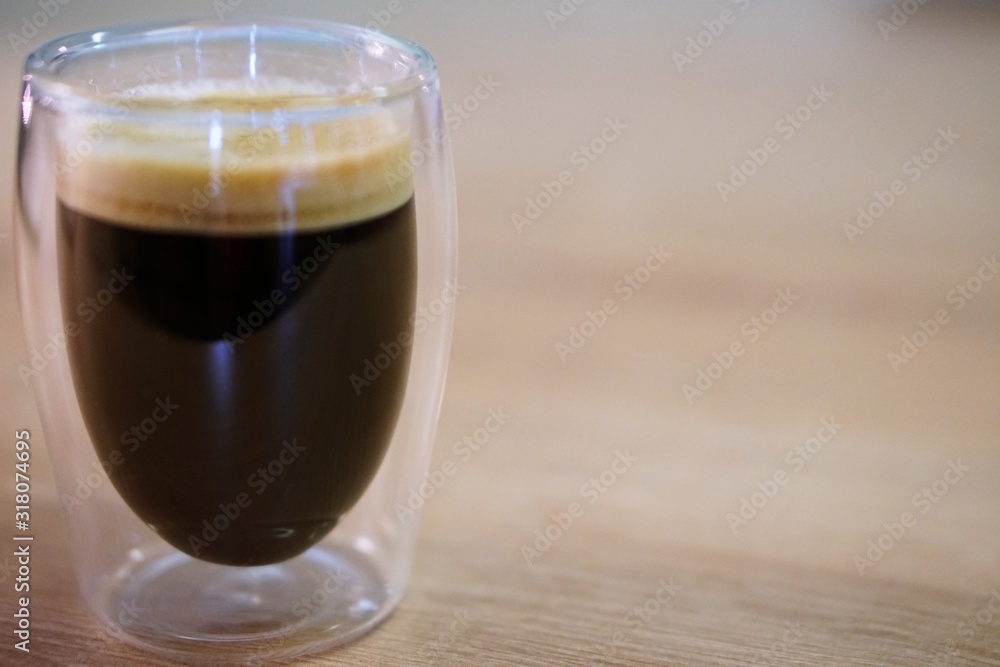 Coffee time in office. Capsule espresso in double glass cup - 100% arabica Coffee time in office. Capsule espresso in double glass cup - 100% arabica