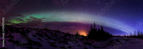 Northern lights ( Aurora Borealis ) at sunrise in Iceland