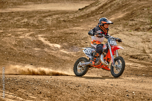 A child at a motocross training session in Moscow at the Technical Sports Stadium