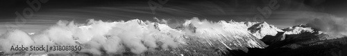 Black and White Artistic Render. Whistler, British Columbia, Canada. Beautiful View of the Canadian Snow Covered Landscape with Blackcomb Mountain in Background during a cloudy and sunny winter day.