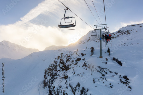 Whistler Ski Resort, British Columbia, Canada. Beautiful View of the snowy Canadian Nature Landscape Mountain and Chairlift going to the peak during a vibrant winter morning.