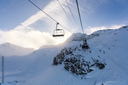 Whistler Ski Resort, British Columbia, Canada. Beautiful View of the snowy Canadian Nature Landscape Mountain and Chairlift going to the peak during a vibrant winter morning.
