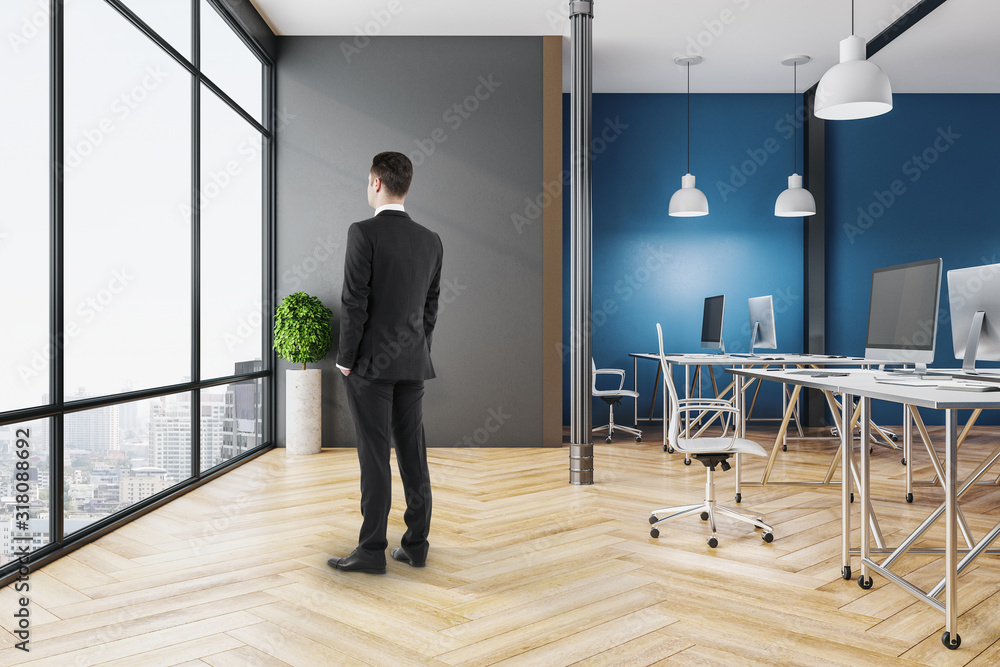 Businessman in coworking office interior Businessman in coworking office interior
