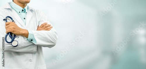 Male doctor standing in the hospital office. Medical healthcare and doctor service. photo