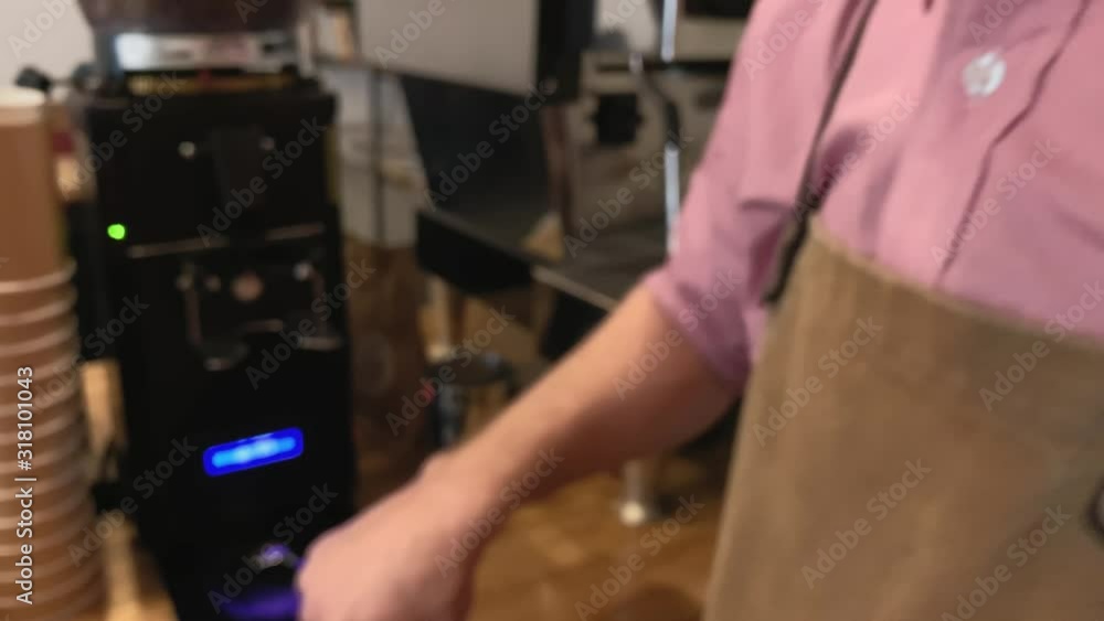 Slow. Process of making coffee. Closeup of hand holding a portafilter with ground coffee on the edge of the table, another hand presses it with a tamper. Concept of energy. Coffee 4k stock footages Slow. Process of making coffee. Closeup of hand holding a portafilter with ground coffee on the edge of the table, another hand presses it with a tamper. Concept of energy. Coffee 4k stock footages