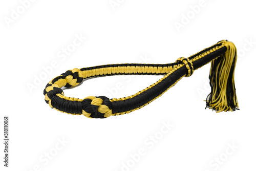 Mongkol with stripes yellow and black are isolated on white background, using by Muay Thai athletes, is a headband with a long - tailed at the back.