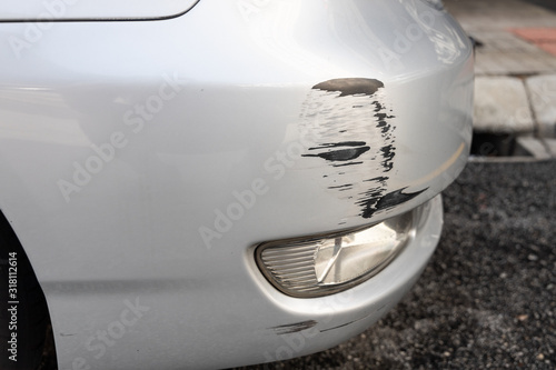 Scratch on car bumper due to minor accident photo