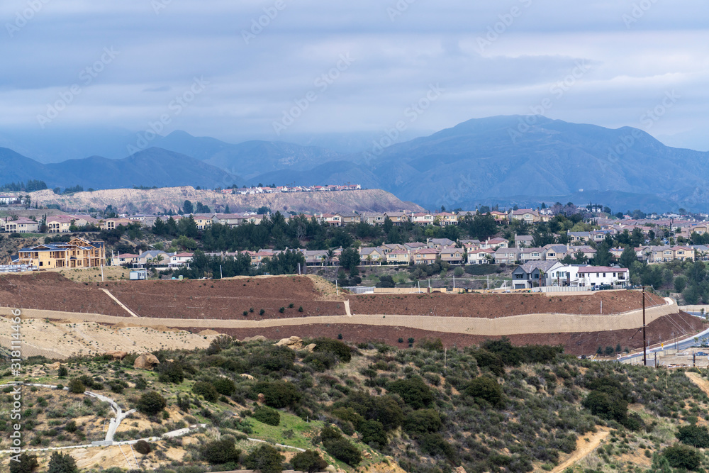 Hilltop homes overlooking the San Fernando Valley in the Porter Ranch neighborhood of Los Angeles, California.  The San Gabriel Mountains and Angeles National Forest are in the background.