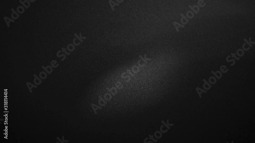 Stop motion animated black canvas pattern background. Surface with spotlight, dark tone.