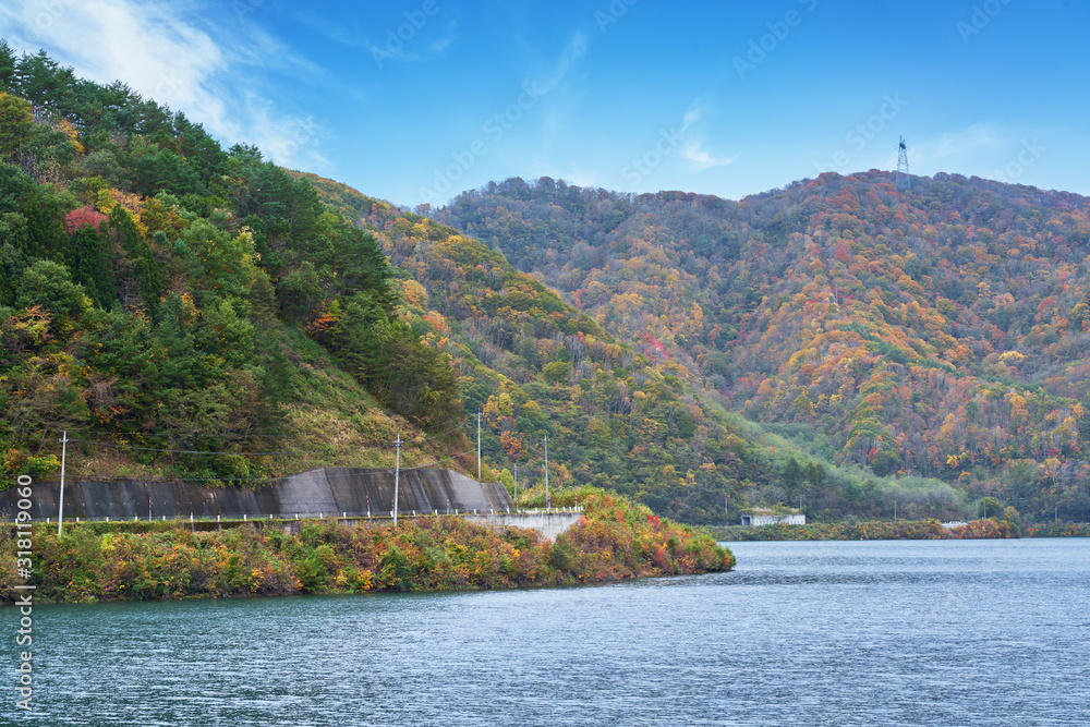 Fototapeta premium landscape of autumn season of fukushima with ouchi dam and colorful mountain