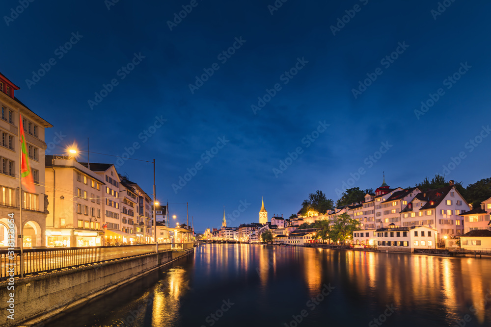 Fototapeta premium Cityscape of Zurich City and Illuminated Lights at Nightlife, Landscape Historic Old Town of Zurich, Switzerland. Panoramic View Medieval Architecture of Switzerland at Night. Travel Place Landmark