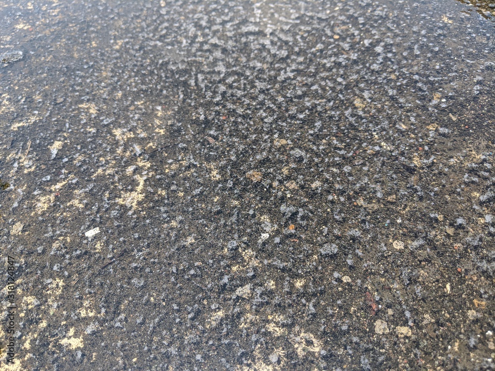 Texture of water on a cement floor, puddles on concrete, top view