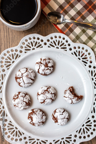Chocolate Almond Crinkle Cookies on a White Plate