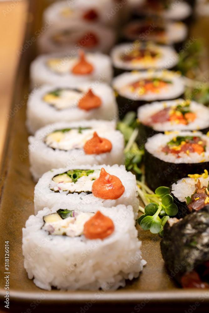 Inside and outside Sushi Rolls decorated with flowers and trimmings Inside and outside Sushi Rolls decorated with flowers and trimmings