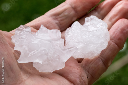 Fényképezés Hail stones held in hand after thunder storm