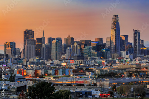 City skyline after sunset with colorful clouds and financial district downtown skyscrapers in San Francisco, California