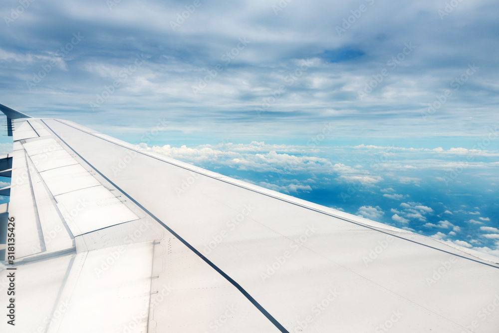 Clouds and sky as seen through window of an aircraft