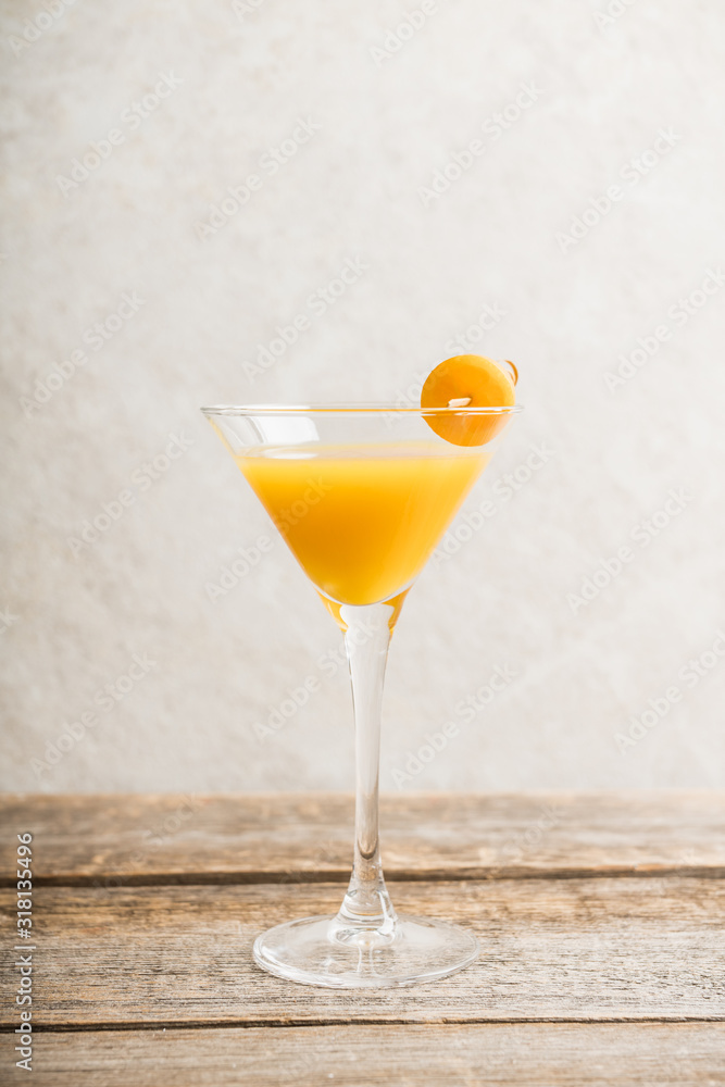 Sweet cocktail with kumquats on rustic background. Selective focus. Shallow depth of field.