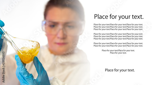 Girl holds a test tube. Pla...