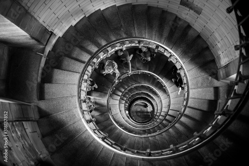 Incredible spiral staircase to the top of Eckmuhl lighthouse  on the Penmarsh Peninsula. Black and white image. Brittany. France