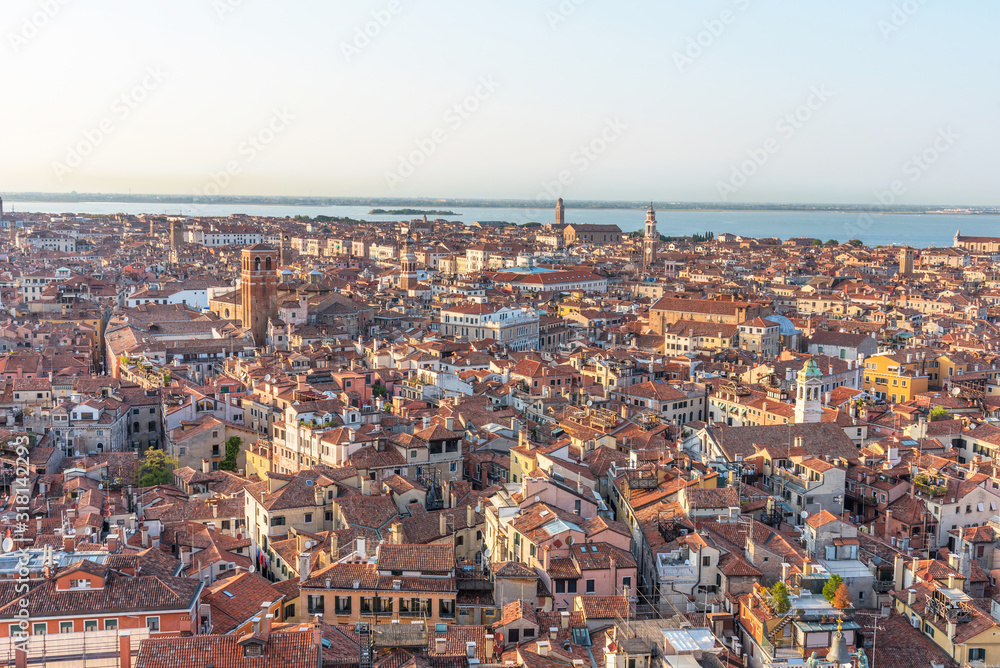 Picturesque panoramic view of Venice, Italy. Aerial scenery view with red roofs of houses.