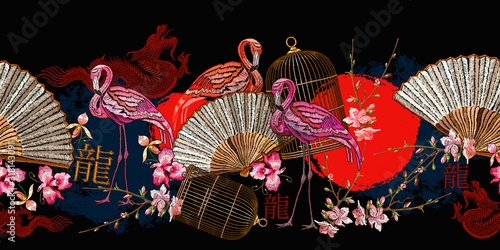 Asian horizontal seamless pattern. Pink flamingo, japan fan, rising red sun, golden cage and sakura flowers. Hieroglyph dragon. Fashion oriental art. Japanese and Chinese style. Ethnic template