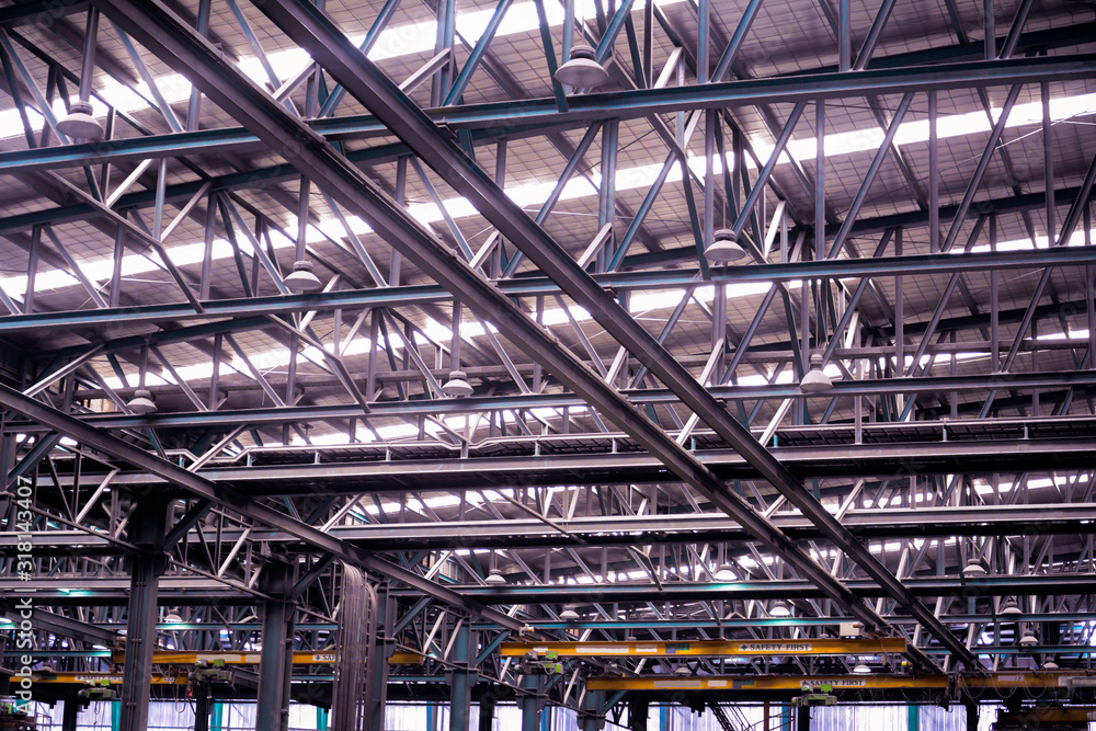 Roof steel beam structure in Industrial factory, Background of factory ceiling with one light blub, Abstract background