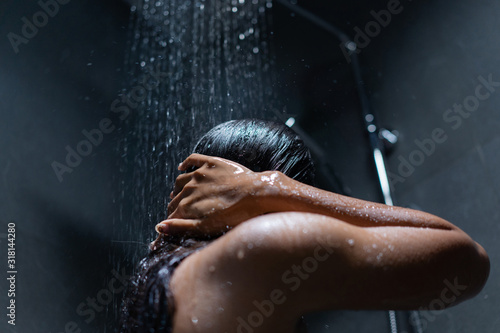 Woman bathing and washing her hair relaxed.