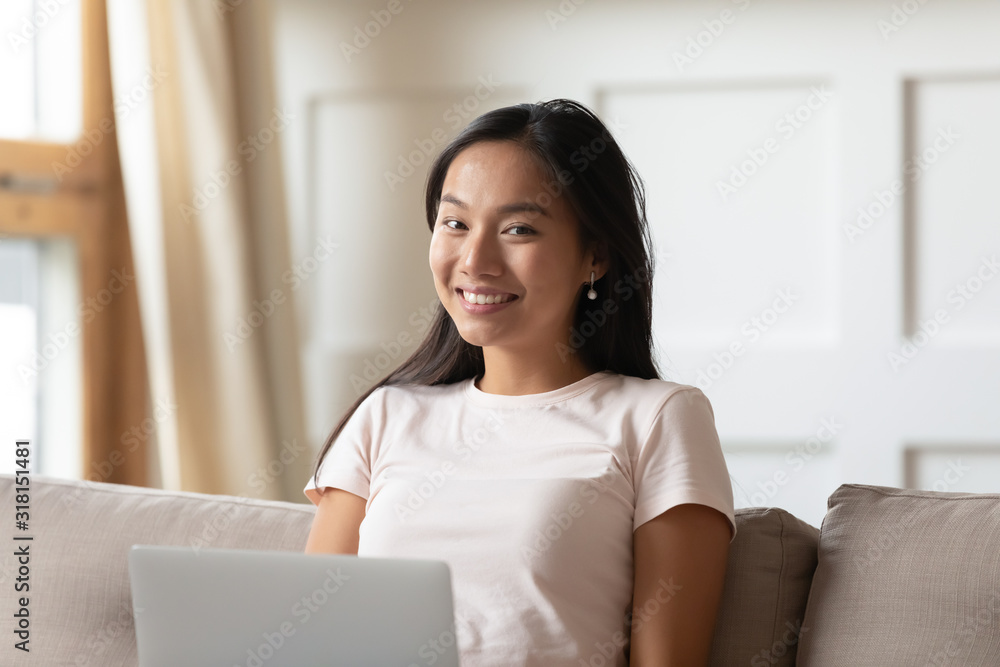 Happy Asian girl working browsing web on laptop Happy Asian girl working browsing web on laptop