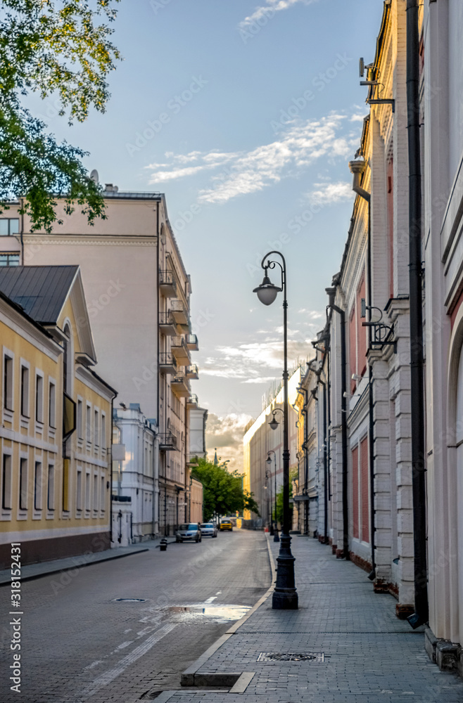 Moscow street in quiet historical city center (Kremlin star in  background)