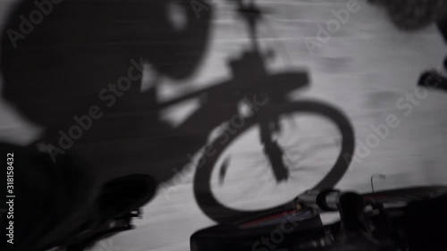 man rides a bicycle pedal view shadow of a bicycle, night 4k