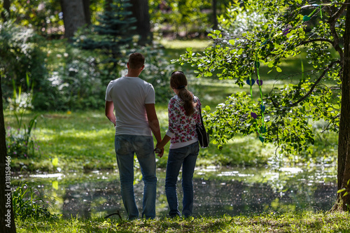 PETERGOF / RUSSIA - AUGUST 2015": Young couple in palace park of Petergof, Russia