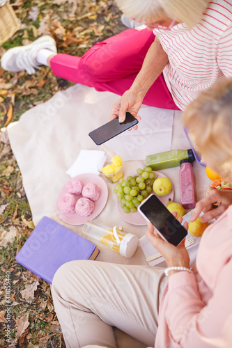 Old friends befriending each other on social media photo