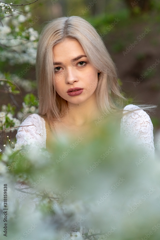 beautiful blonde girl in spring cherry garden beautiful blonde girl in spring cherry garden