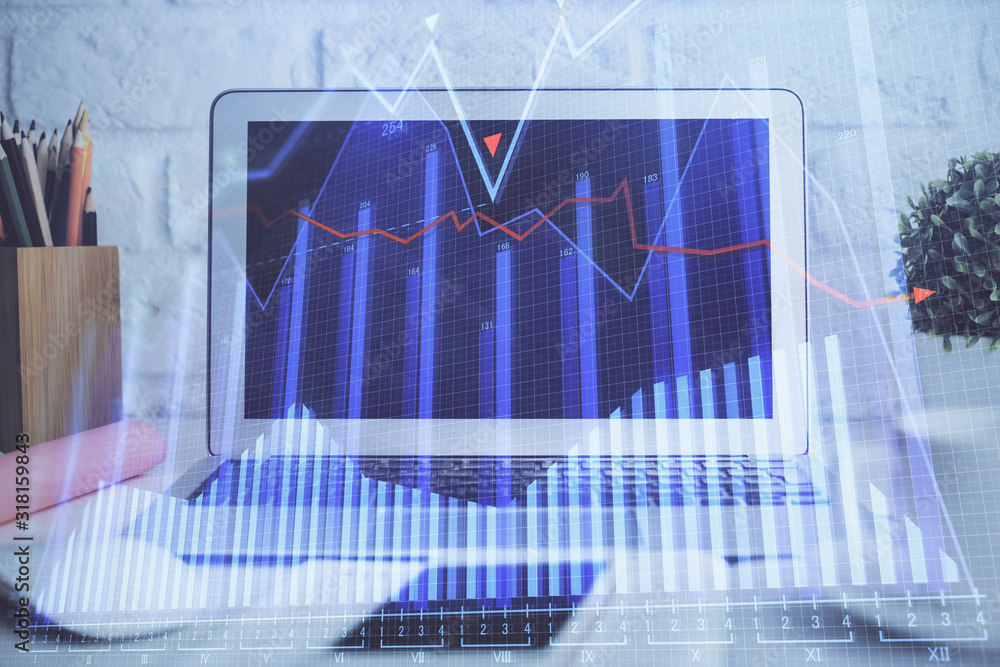 Financial market graph hologram and personal computer on background. Double exposure. Concept of forex. Financial market graph hologram and personal computer on background. Double exposure. Concept of forex.