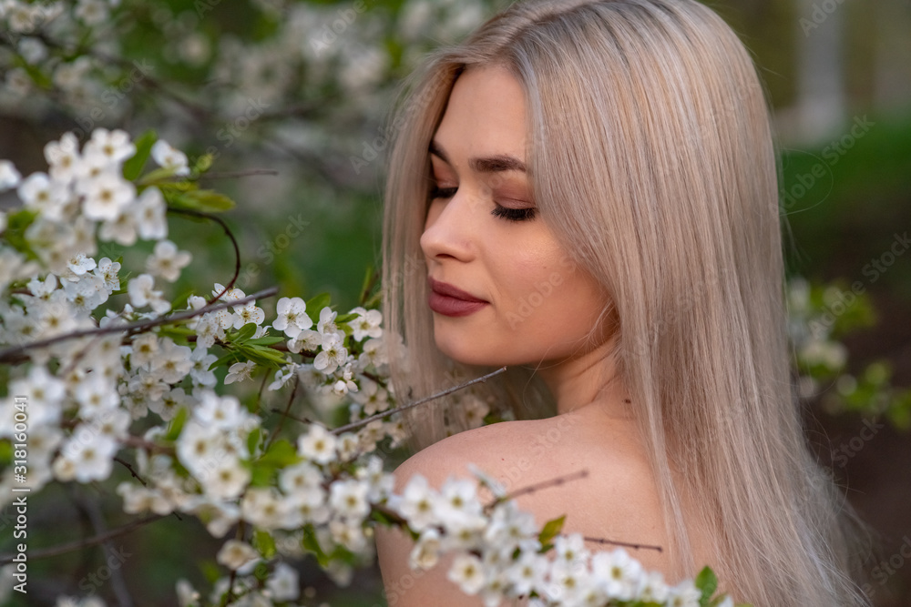 beautiful blonde girl in spring cherry garden beautiful blonde girl in spring cherry garden