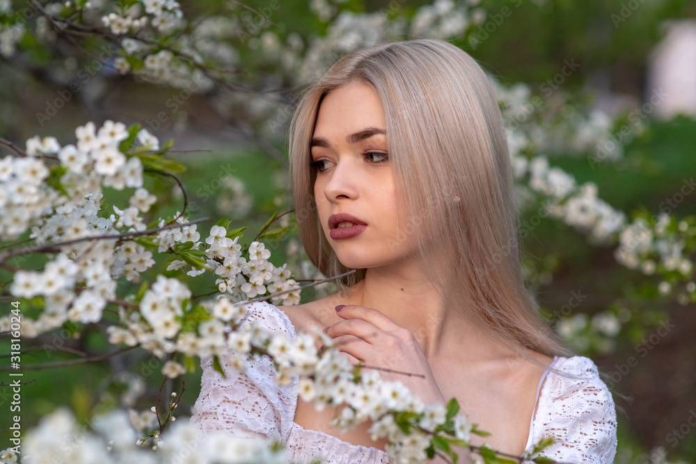 beautiful blonde girl in spring cherry garden beautiful blonde girl in spring cherry garden