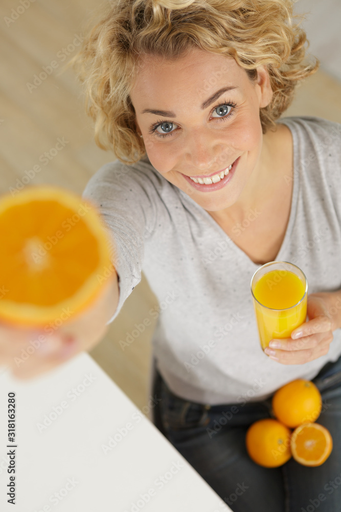beautiful young woman with glass of orange juice beautiful young woman with glass of orange juice