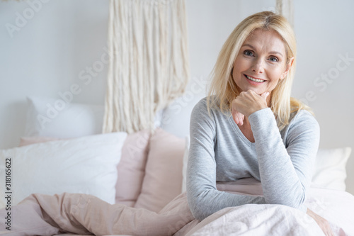 Confident smiling woman in the morning stock photo
