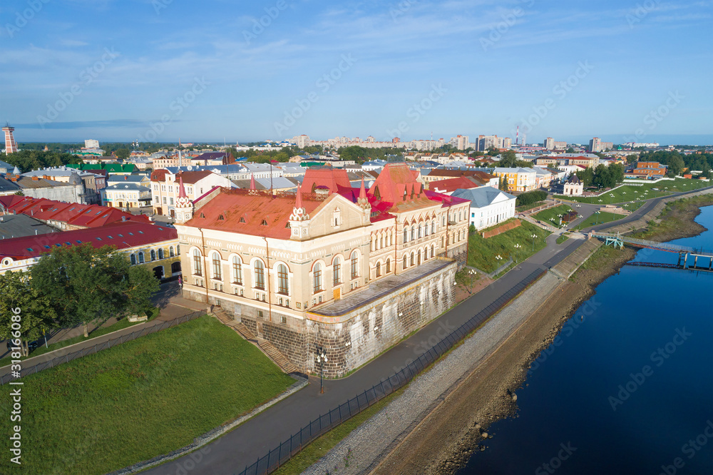 View of the old building of the Bread Exchange (1912) on the embankment of the Volga River on a July day (shooting from a quadrocopter). Rybinsk, Russia