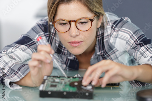 female computer technician wearing eyeglasses