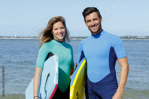 couple bodyboarders looking at camera photo