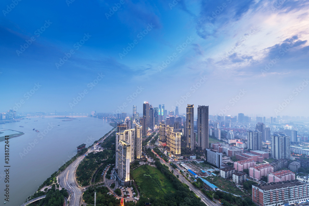 Fototapeta premium Bird view at Nanchang China. Skyscraper under construction in foreground. Fog, overcast sky and pollution. Bund (Nanchang) area