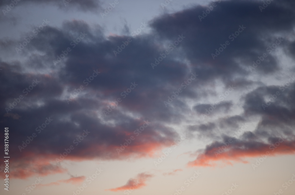 Naklejka premium Blue and red clouds in the sky