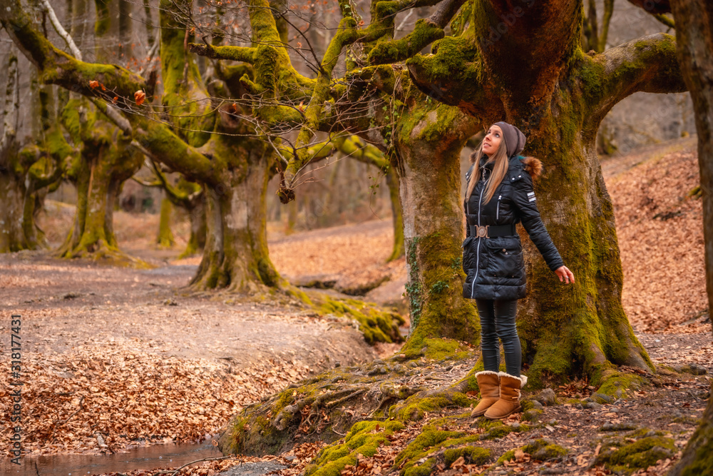 A young girl in a beautiful fantasy forest A young girl in a beautiful fantasy forest