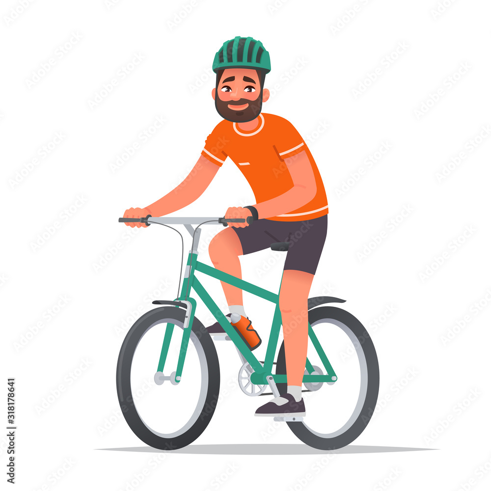 Happy man dressed in sportswear and a helmet rides a bicycle. Bike ride. Cyclist. Leisure and Active holiday Happy man dressed in sportswear and a helmet rides a bicycle. Bike ride. Cyclist. Leisure and Active holiday