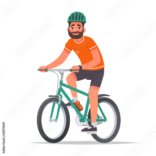 Happy man dressed in sportswear and a helmet rides a bicycle. Bike ride. Cyclist. Leisure and Active holiday