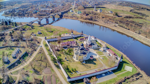 Staritskiy Holy Dormition Monastery is Orthodox monastery in Staritsa town of Tver Oblast, Russia, located on Volga River. Sunny summer day. Aerial view. photo